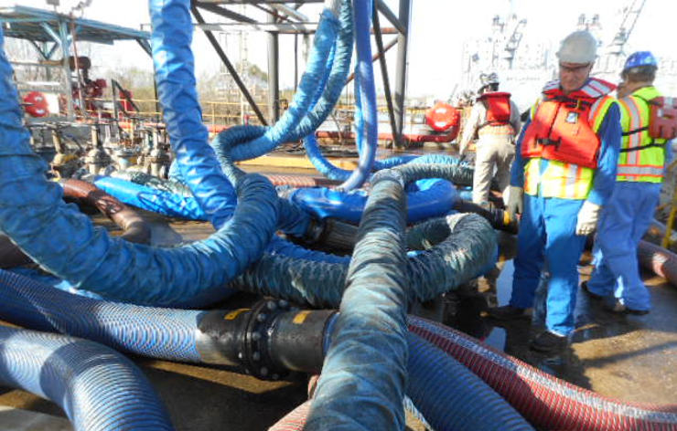 Engineering Bulletin #141 4 Metal hoses stacked on a ship terminal dock. Stacking leads to premature hose failures.